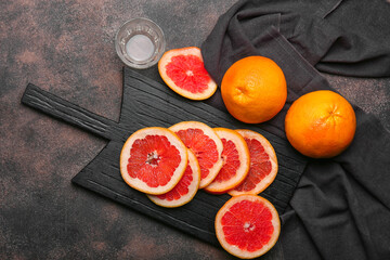 Fresh cut grapefruit on grey background