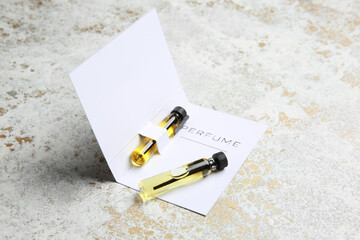 Perfume samples on light background