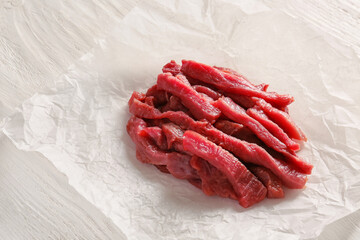 Pieces of fresh beef meat on table