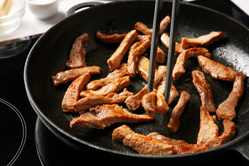 Cooking of tasty beef stroganoff, closeup