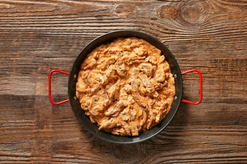 Tasty beef stroganoff on table