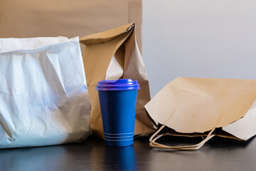 delivery service package cup bag box blue food open coffee to go