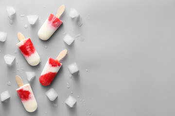 Tasty strawberry ice cream on grey background