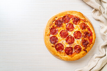 pepperoni pizza on wood tray