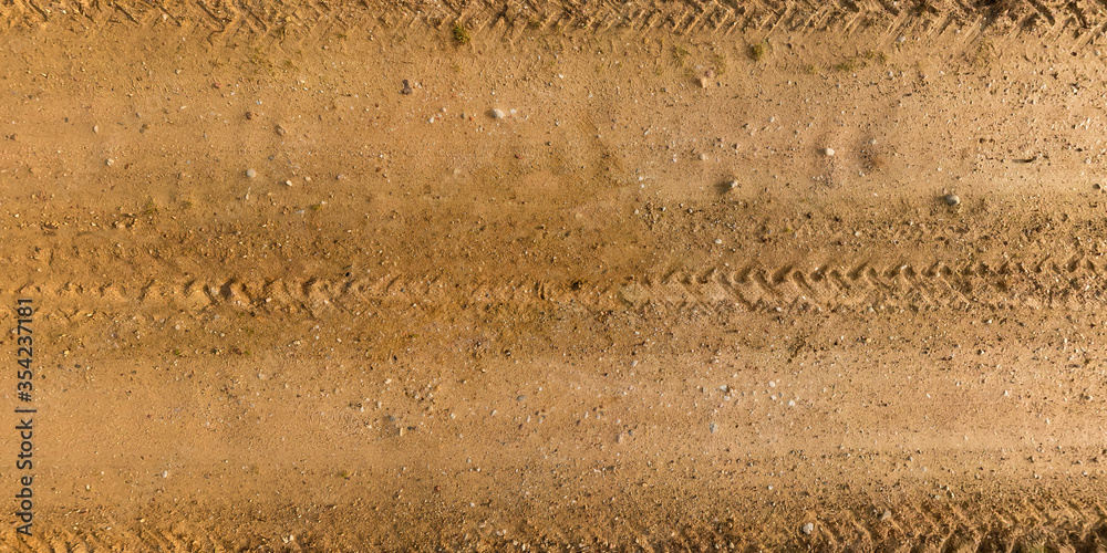 Wall mural view from above on texture of gravel road