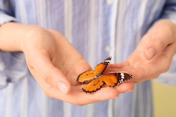 Woman with beautiful butterfly, closeup