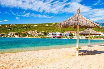 Adriatic sea shore in Croatia on Pag island, parasol on beautiful Puntica sand beach
