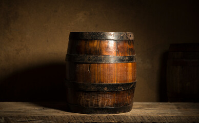 the still life with red wine, bottle, glass and old barrel