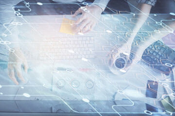 Double exposure of man and woman working together and data theme hologram drawing. Computer background. Top View.