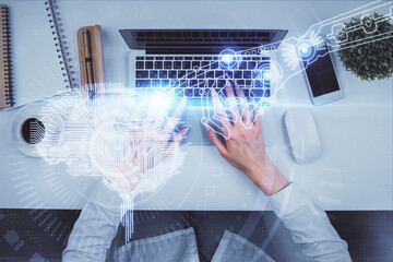 Double exposure of woman working on computer andhuman brain hologram drawing. Top View. Ai concept.