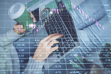 Double exposure of woman hands typing on computer and forex chart hologram drawing. Stock market invest concept.