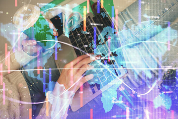 Double exposure of woman hands typing on computer and business theme hologram drawing. Success concept.