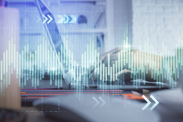 Double exposure of woman hands typing on computer and forex chart hologram drawing. Stock market...