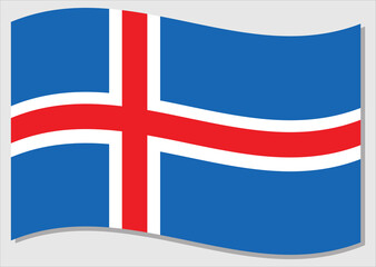 Waving flag of Iceland vector graphic. Waving Icelander flag illustration. Iceland country flag wavin in the wind is a symbol of freedom and independence.