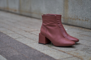 Footwear. Boots. Shoes for autumn and spring. Style and . fashion. Boots on the street. White and maroon. High quality photo