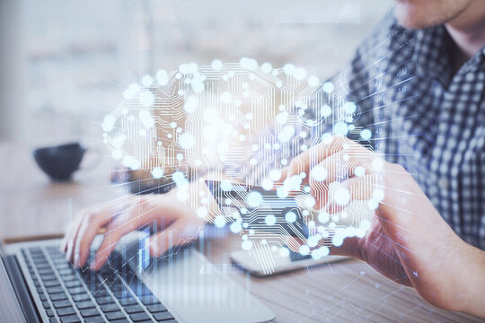 Double exposure of man hands typing on computer with credit card and brain theme drawing. E-commerce and AI concept.