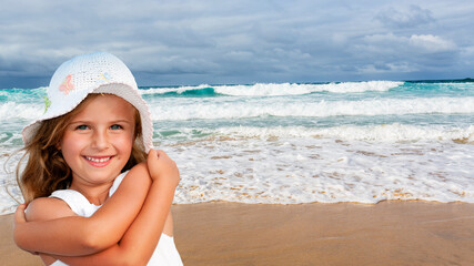Young girl relaxing on the beach.