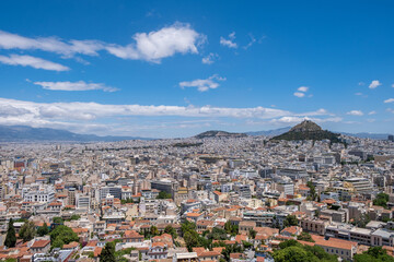 Fototapeta na wymiar Mount Lycabettus and Athens cityscape view from Acropolis hill in Greece, blue sky, sunny day.
