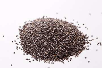 Chia seeds on a white isolated background close-up.