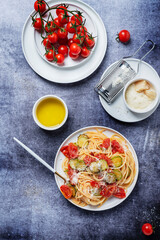 Traditional Italian pasta with tomato, zucchini and parmesan