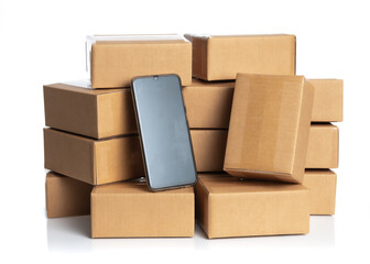 Stack of cardboard boxes for delivery with smartphone isolated on white,Online order, tracking and delivery concept