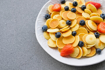 Freshly cooked pancake cereal served with fresh berries.