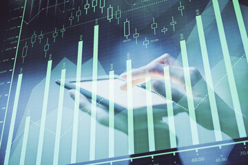 Double exposure of forex chart sketch hologram and woman holding and using a mobile device. Financial market concept.