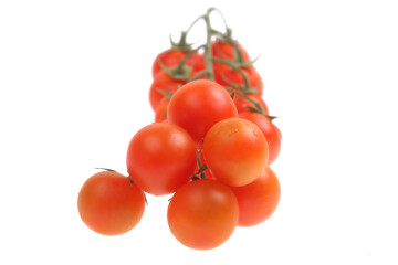 bunch of round red tomatoes on a white background