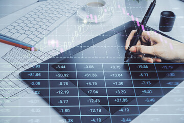 Double exposure of financial graph sketch hologram and woman holding and using a mobile device. Stock exchange concept.