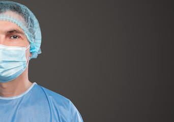 Surgeon in medical mask on gray background
