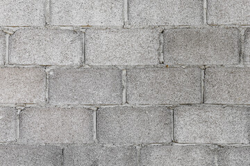 Background of grey blocks in construction area. Wall of concrete block.