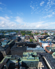 View from top on Railway Square and Central station at day time in Helsinki. Blue sky and clouds. Summer. City center aerial view. Finland