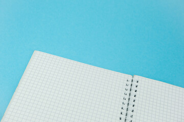Close up of the notebook on the blue background