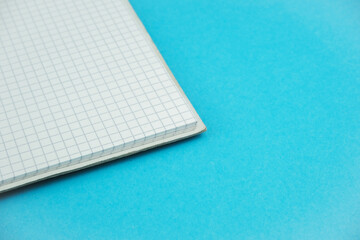 Close up of the notebook on the blue background