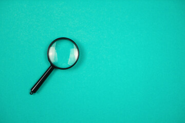 Magnifier on the green background, close up