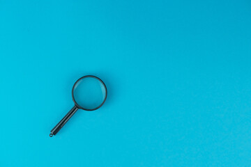 Magnifier on the blue background