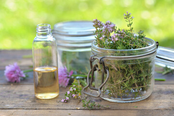 aromatic herbs  leaf  in glass jar on a table in garden