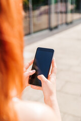 Hands with smartphone touchs screen and using app