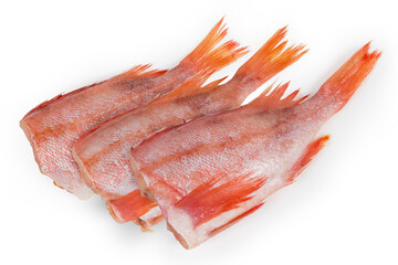 Raw headless gutted carcass of redfish on a white background
