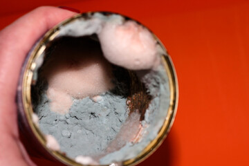 In the hand of the Bank with the spoiled food. Food with mold. Delayed goods. Poisonous food.