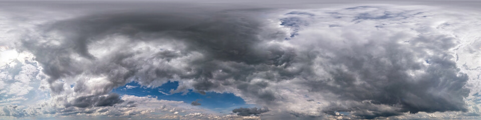 blue sky with beautiful dark clouds before storm. Seamless hdri panorama 360 degrees angle view...