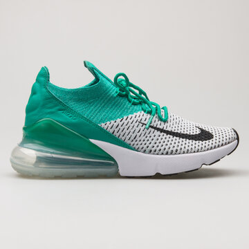 VIENNA, AUSTRIA - FEBRUARY 19, 2018: Nike Air Max 270 Flyknit white and green sneaker on white background.
