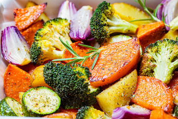 Baked vegetables in the oven dish. Grilled sweet potato, zucchini and broccoli. Healthy vegan food...