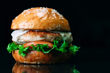 Juicy beef Burger on a black background.