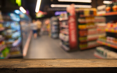 Wood top table on blur supermarket background