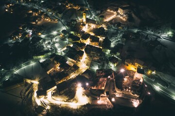 Ossana village in Italy at night aerial drone photo