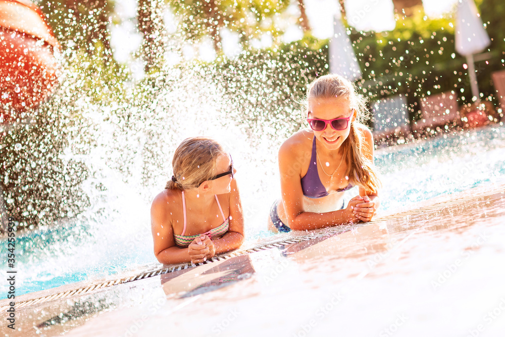 Sticker Happy beautiful girls having fun at the pool