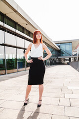 Obraz premium Outdoor photo of beautiful young redhead woman
