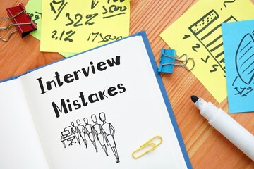 Business concept about Interview Mistakes with phrase on the piece of paper.