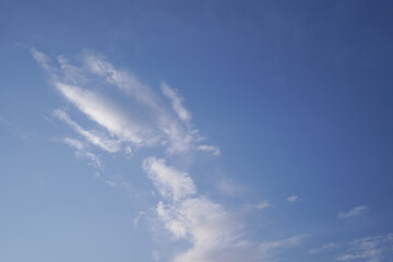 Light and transparent clouds on a background of blue sky.